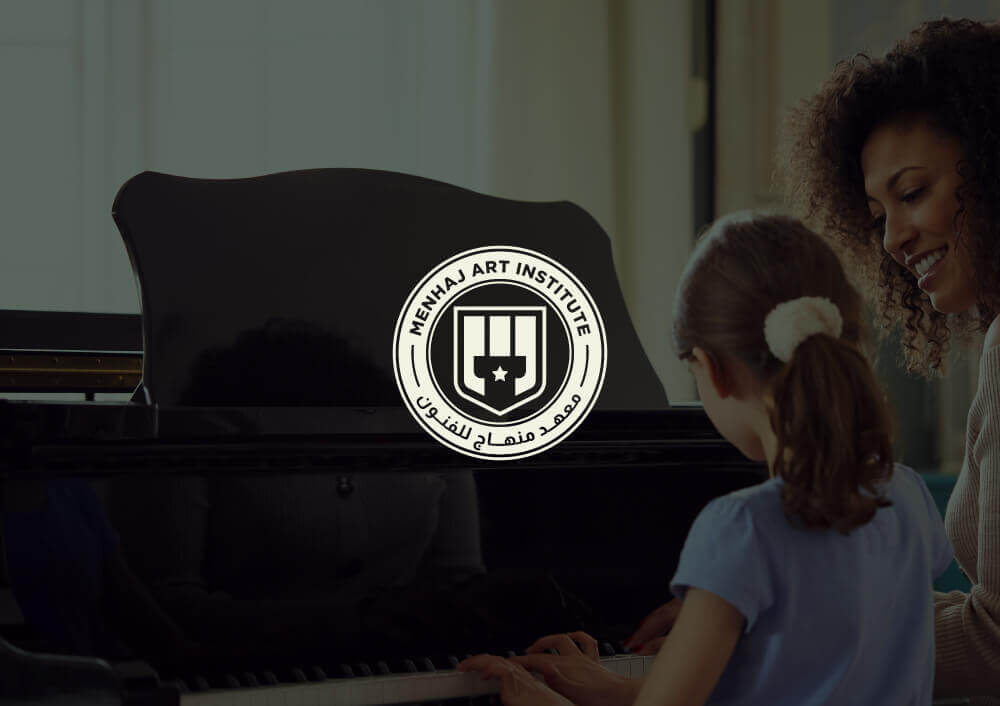 Instructor teaching a young student to play piano at Minhaj Music, supported by Social Media Management from a leading Social Media Agency and Social Media Marketing Agency