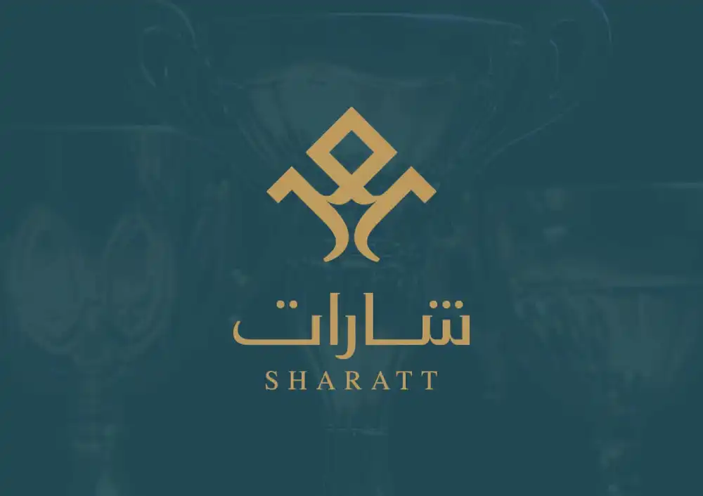 The elegant logo of Sharatt features stylized gold lettering on a dark background, showcasing the brand's identity.