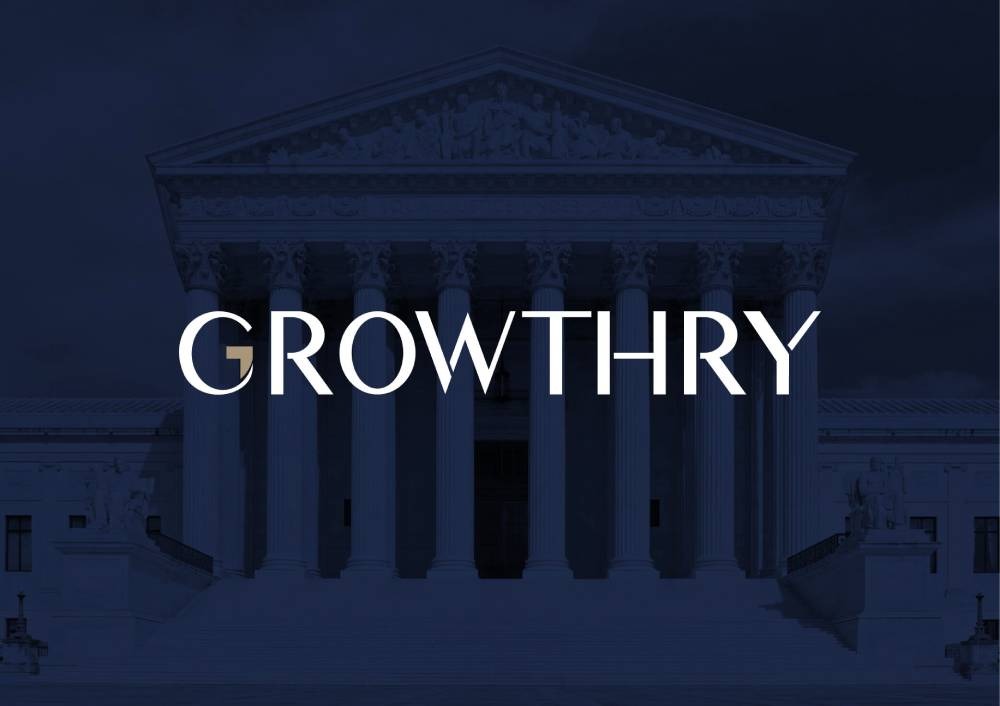 The word GROWTHRY prominently displayed in front of a grand building with classical architecture, symbolizing strength and stability.